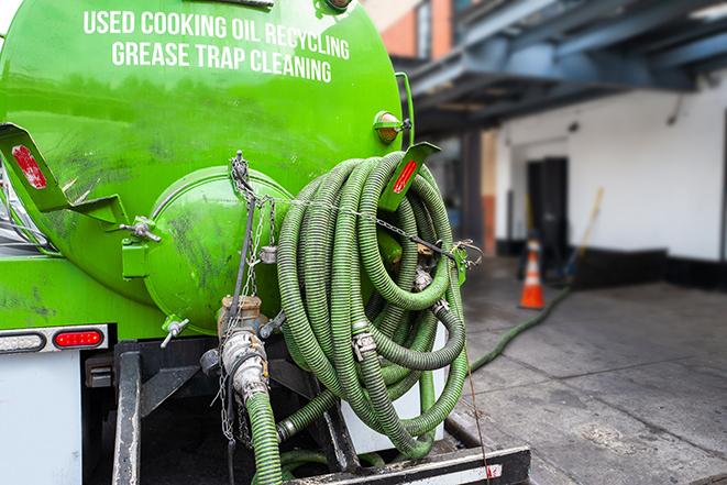 a grease trap pumping truck at a restaurant in Beverly Hills CA